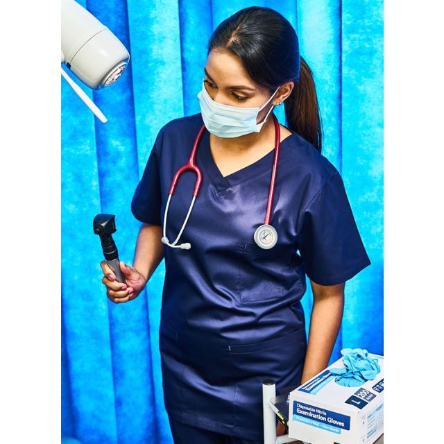 Model wearing ORN Scrub Top