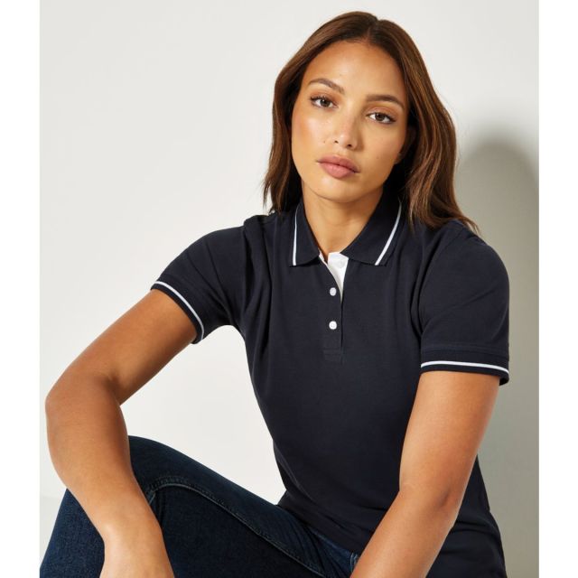 Model wearing Kustom Kit Classic Fit St Mellion Polo