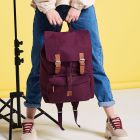 laptop backpack with buckles, zipped compartment, and drawcord closure