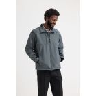 Model wearing Uneek Premium Full Zip Softshell Jacket