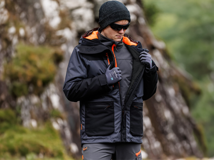 Worker wearing Portwest EV4 all-weather clothing