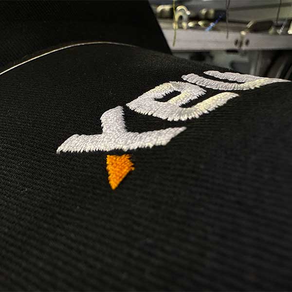 Selection of embroidered workwear garments with company logo examples
