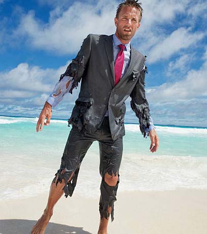Man wearing a torn suit on the beach