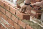 Image of a Brick Layer building a wall