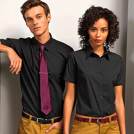 Man and Woman wearing smart office workwear in Black and Brown